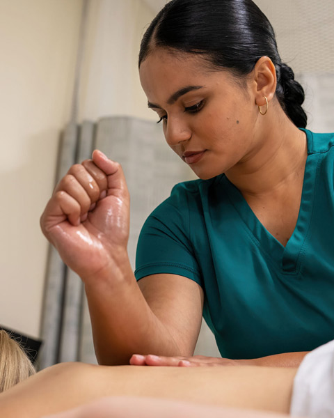 Massage Therapy program student giving a massage